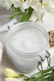 Composition with salt scrub on white wooden table