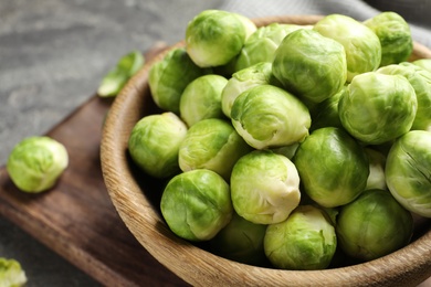 Photo of Bowl of Brussels sprouts on table, closeup
