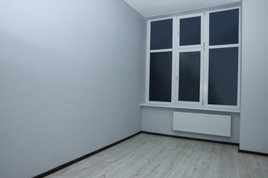 New empty room with clean windows and white walls