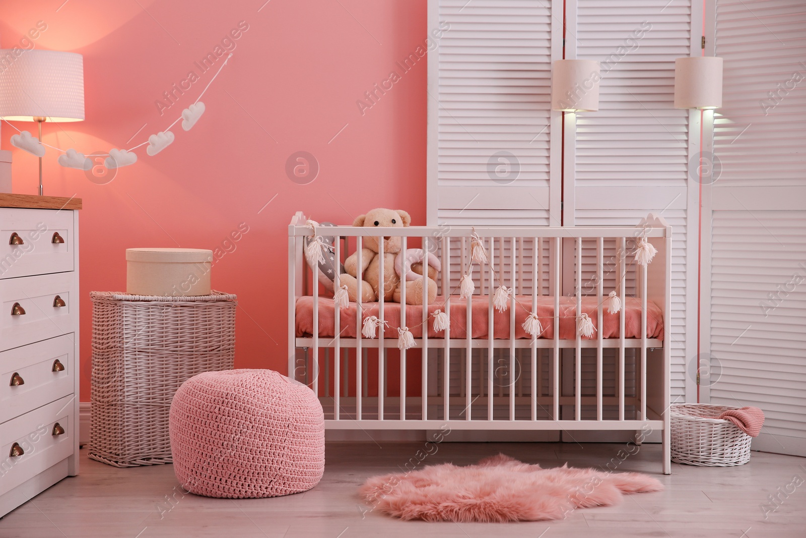 Photo of Baby room interior with decorations and comfortable crib