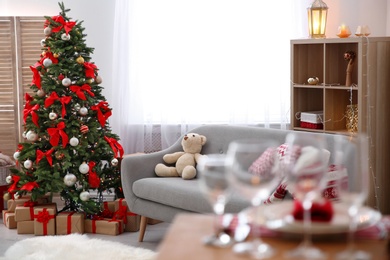 Room interior with beautiful Christmas tree and gifts