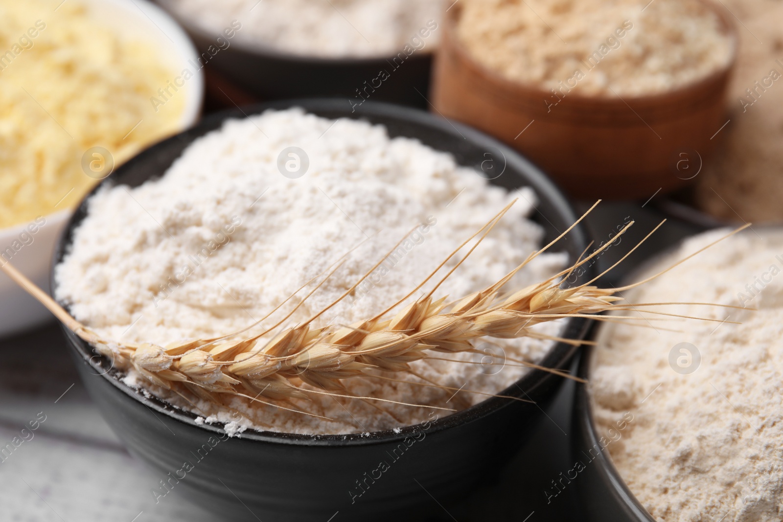 Photo of Bowls with different types of flour, closeup