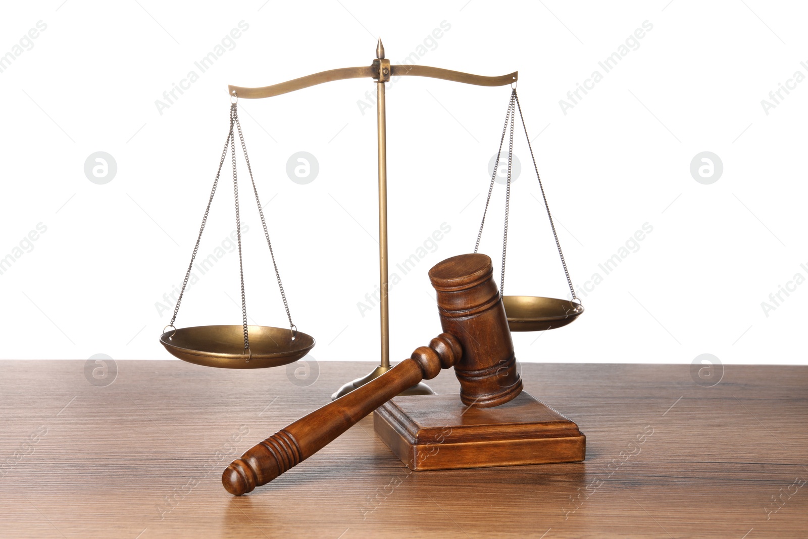 Photo of Law concept. Gavel and scales of justice on wooden table against white background