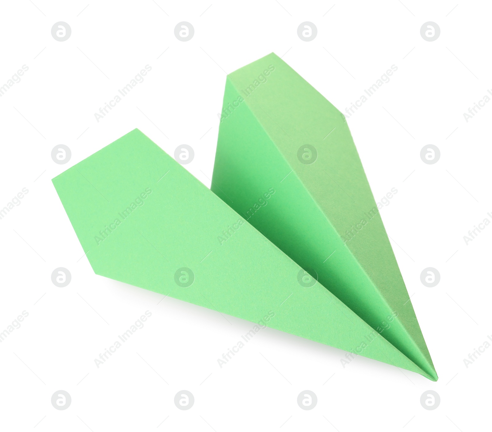 Photo of Handmade green paper plane isolated on white