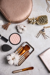 Photo of Flat lay composition with professional makeup brushes on light background