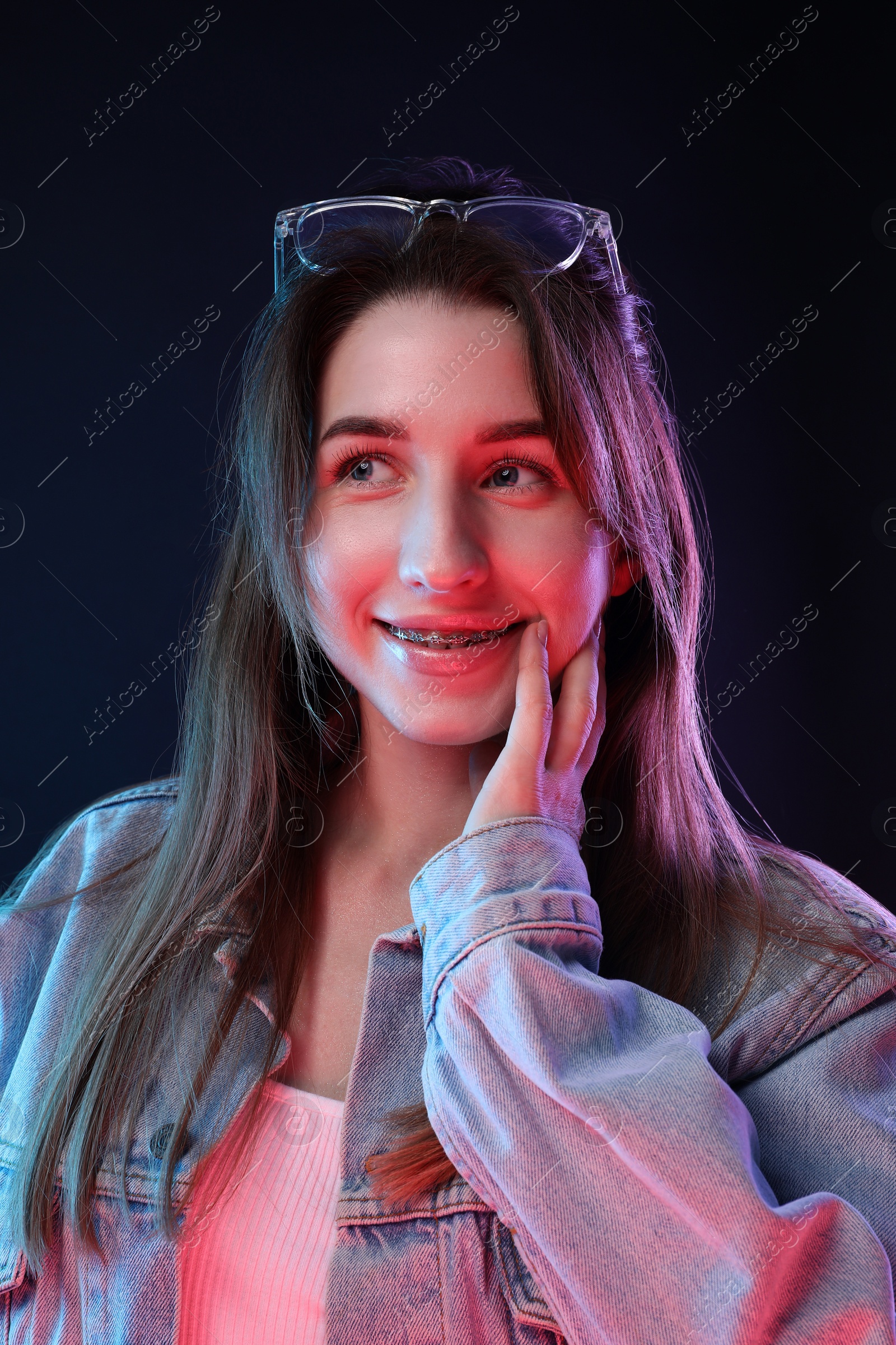 Photo of Portrait of beautiful young woman on color background