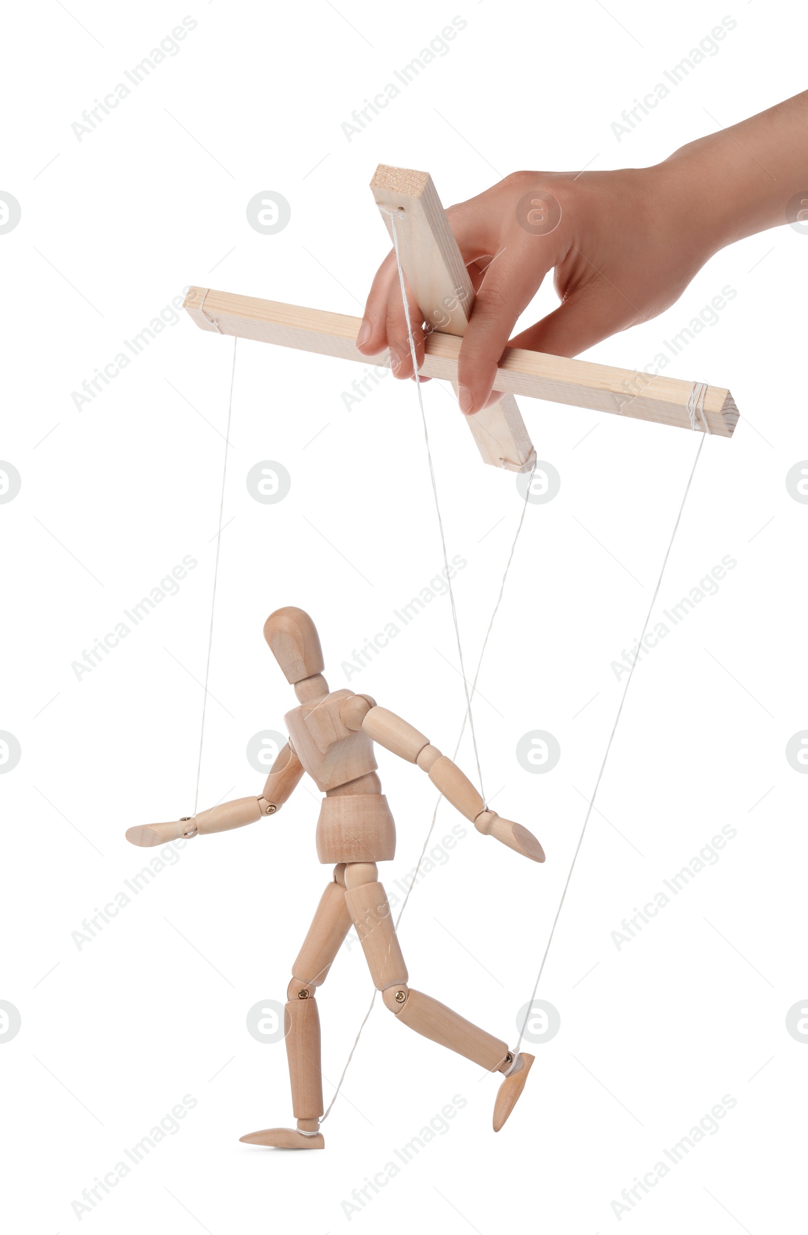 Photo of Woman pulling strings of puppet on white background, closeup