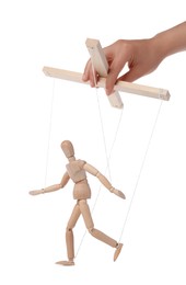 Woman pulling strings of puppet on white background, closeup