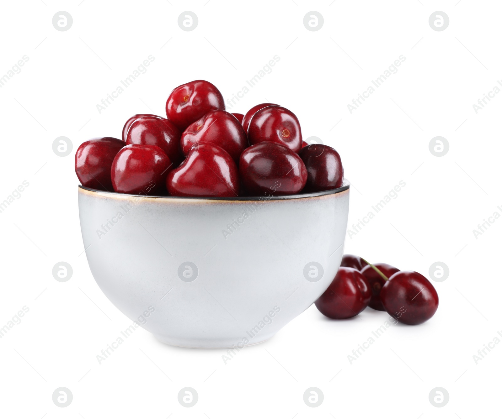 Photo of Tasty ripe red cherries and bowl isolated on white