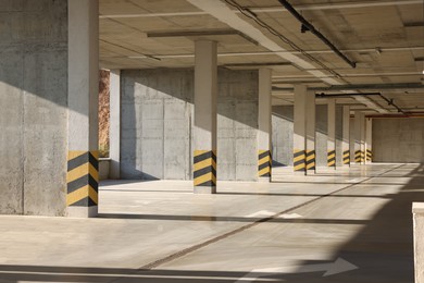 Photo of Empty open car parking garage on sunny day