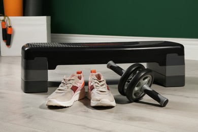 Photo of Step platform and different sports equipment indoors