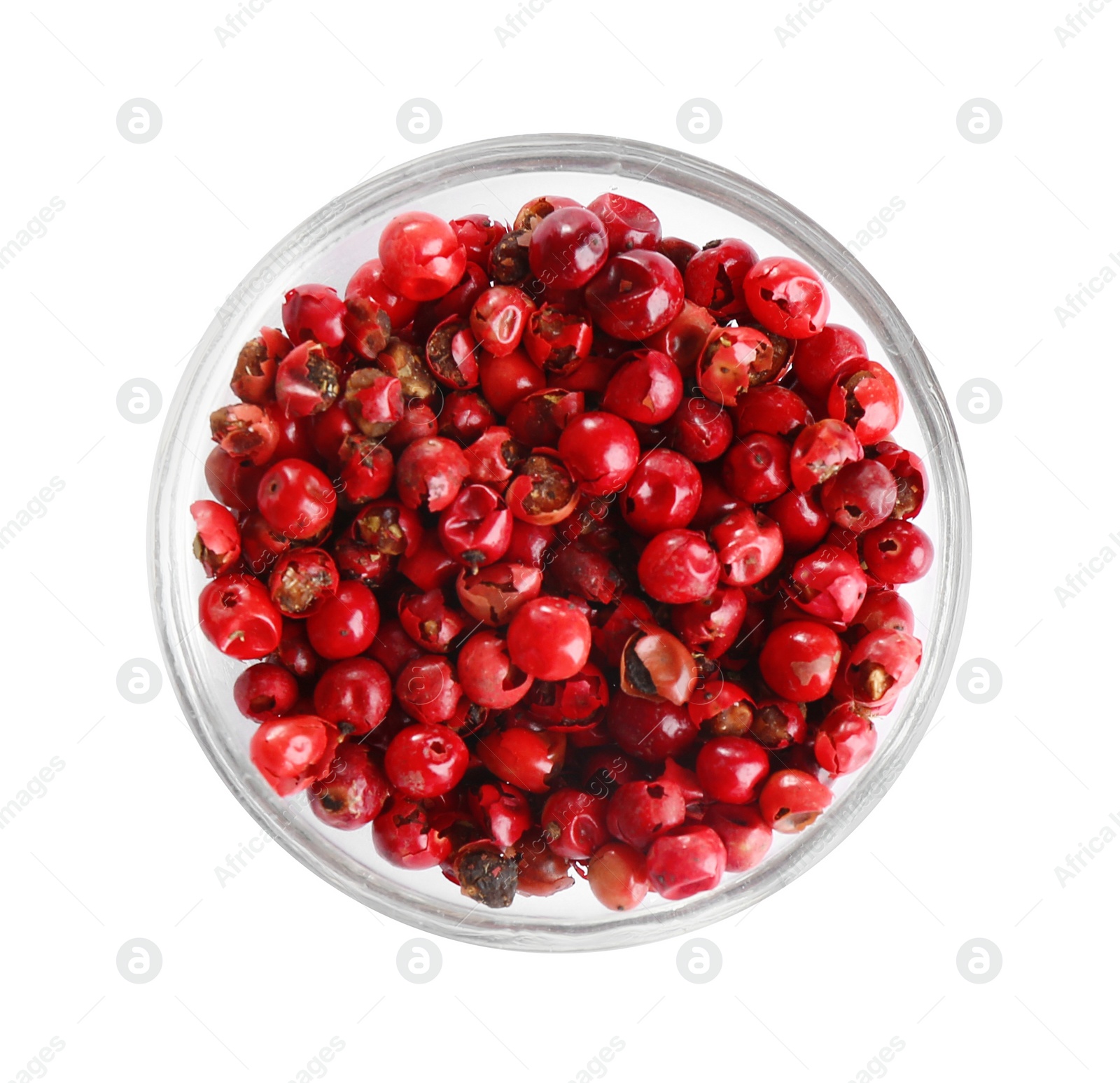 Photo of Bowl of red peppercorns isolated on white, top view