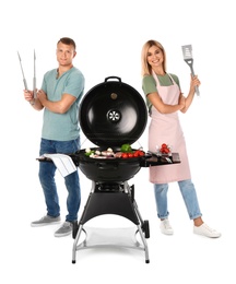 Happy couple cooking on barbecue grill, white background