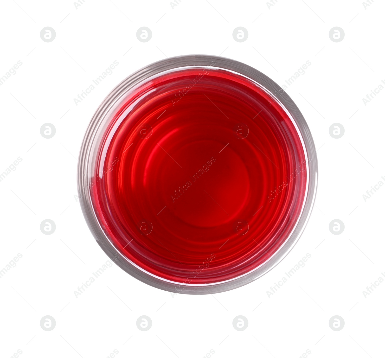 Photo of Tasty cranberry juice in glass isolated on white, top view