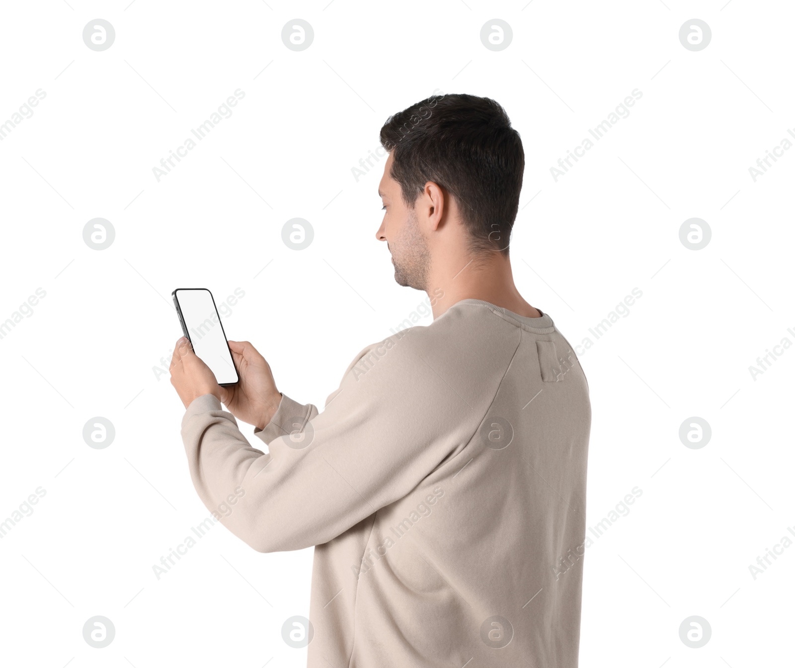 Photo of Man holding smartphone with blank screen on white background