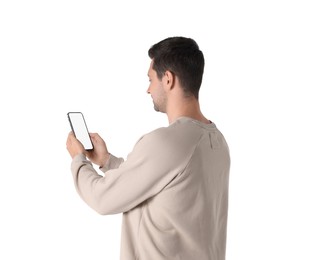 Photo of Man holding smartphone with blank screen on white background