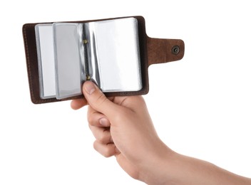 Man holding leather business card holder with blank cards on white background, closeup