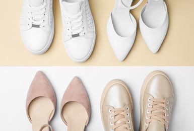 Photo of Stylish female shoes and sneakers on color background, flat lay