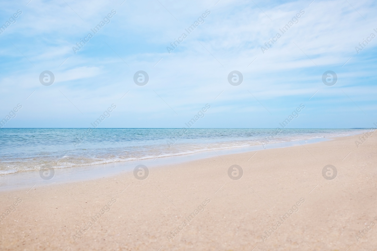 Photo of Beautiful view of sandy beach and sea on sunny day
