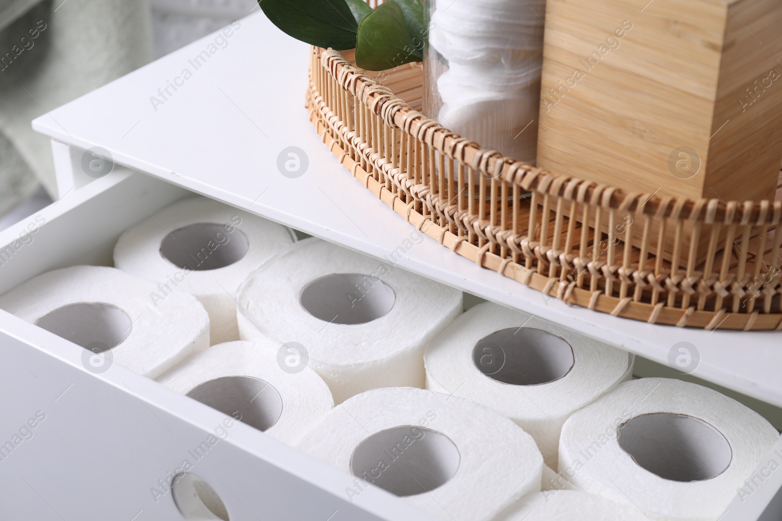 Photo of Many toilet paper rolls in white drawer indoors