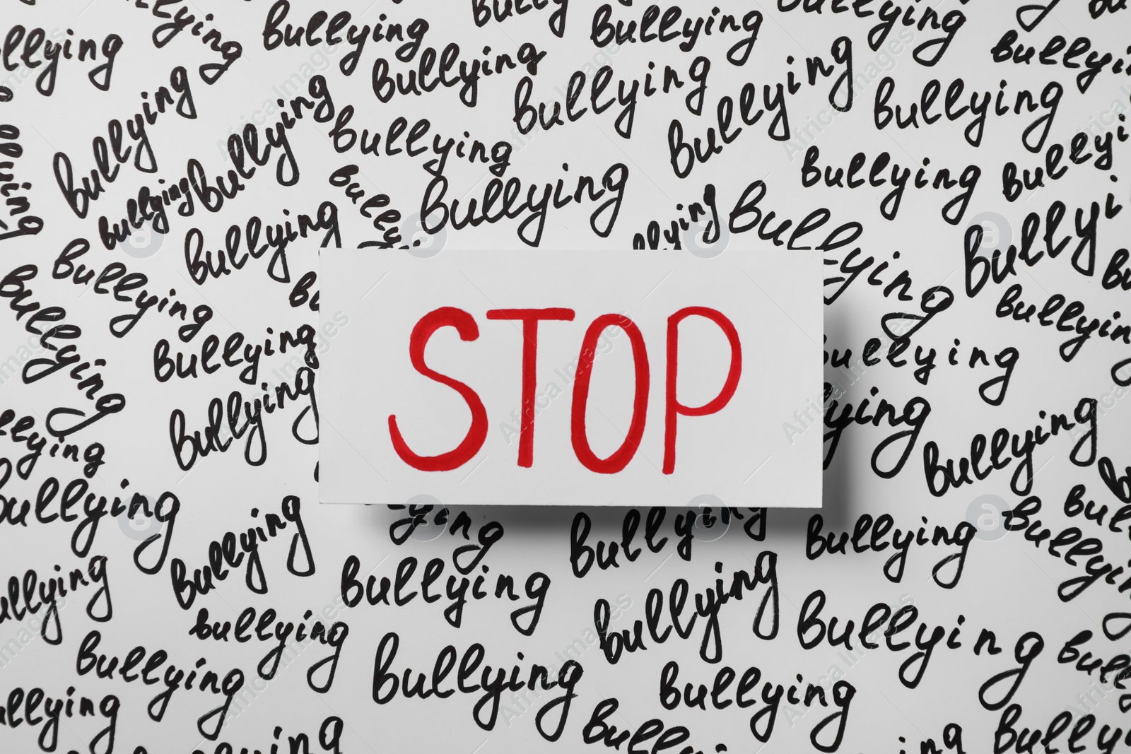 Photo of Composition with text Stop Bullying on white background, top view