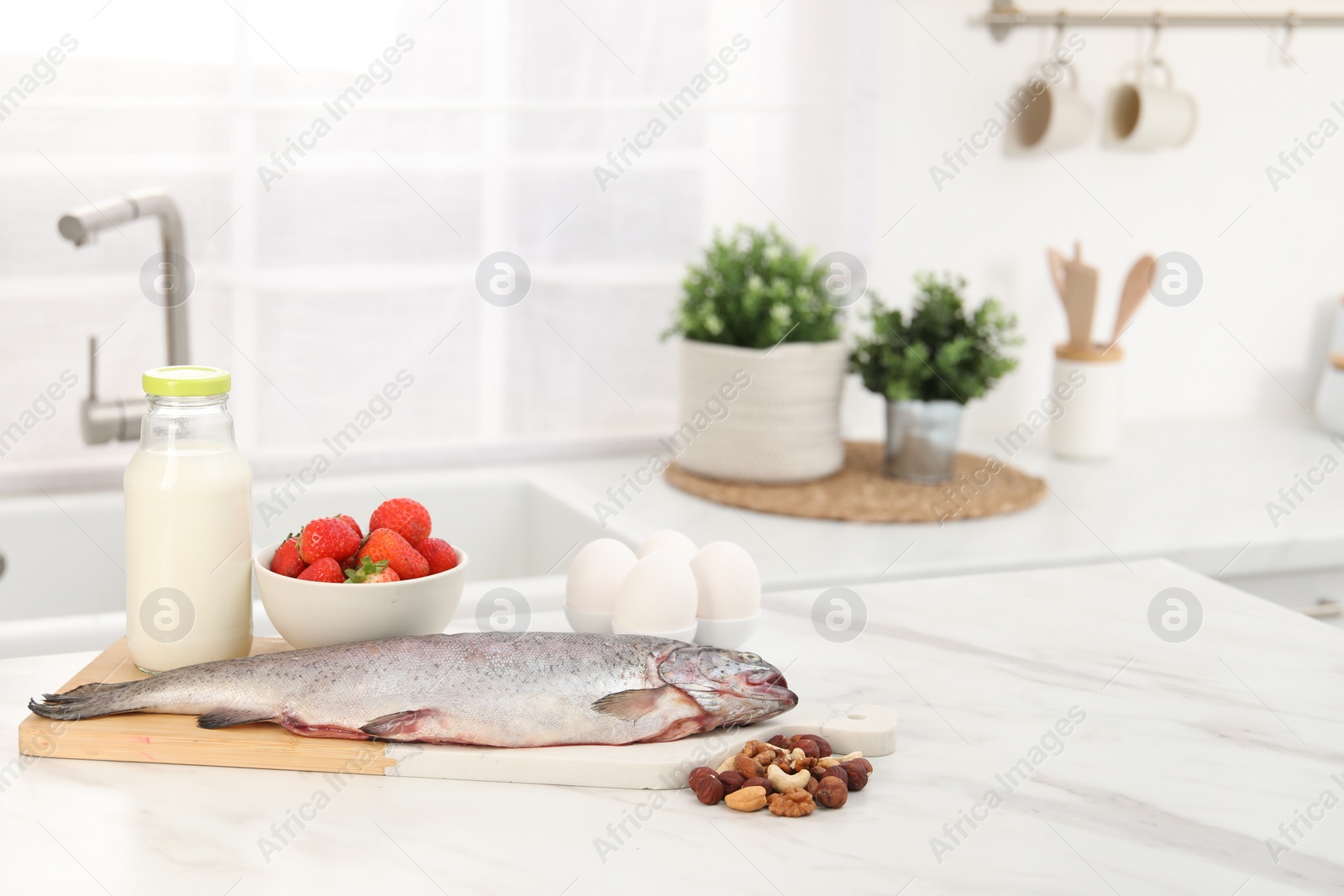 Photo of Allergenic food. Different fresh products on light table in kitchen, space for text