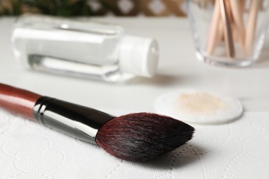 Photo of Makeup brush drying after cleaning on paper towel, closeup