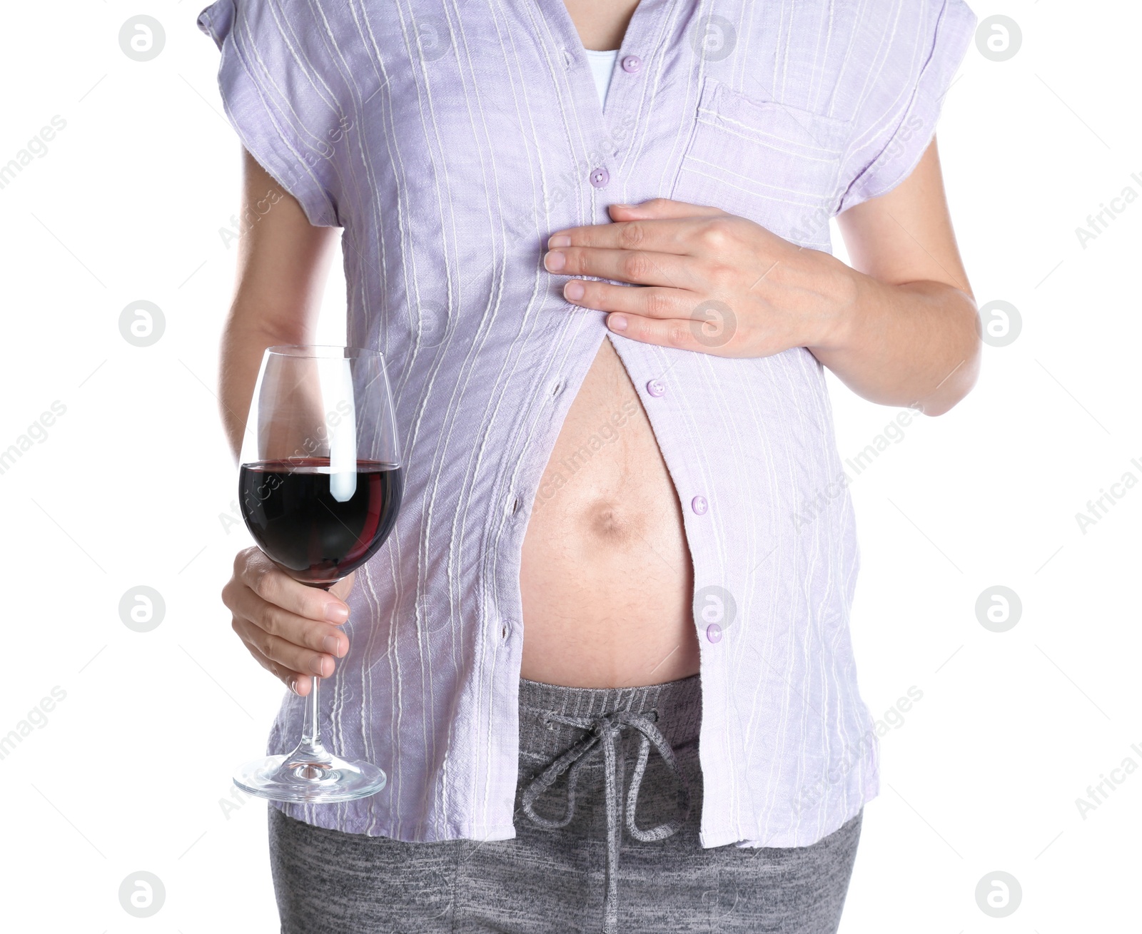 Photo of Pregnant woman with glass of red wine on white background. Alcohol addiction