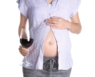 Photo of Pregnant woman with glass of red wine on white background. Alcohol addiction