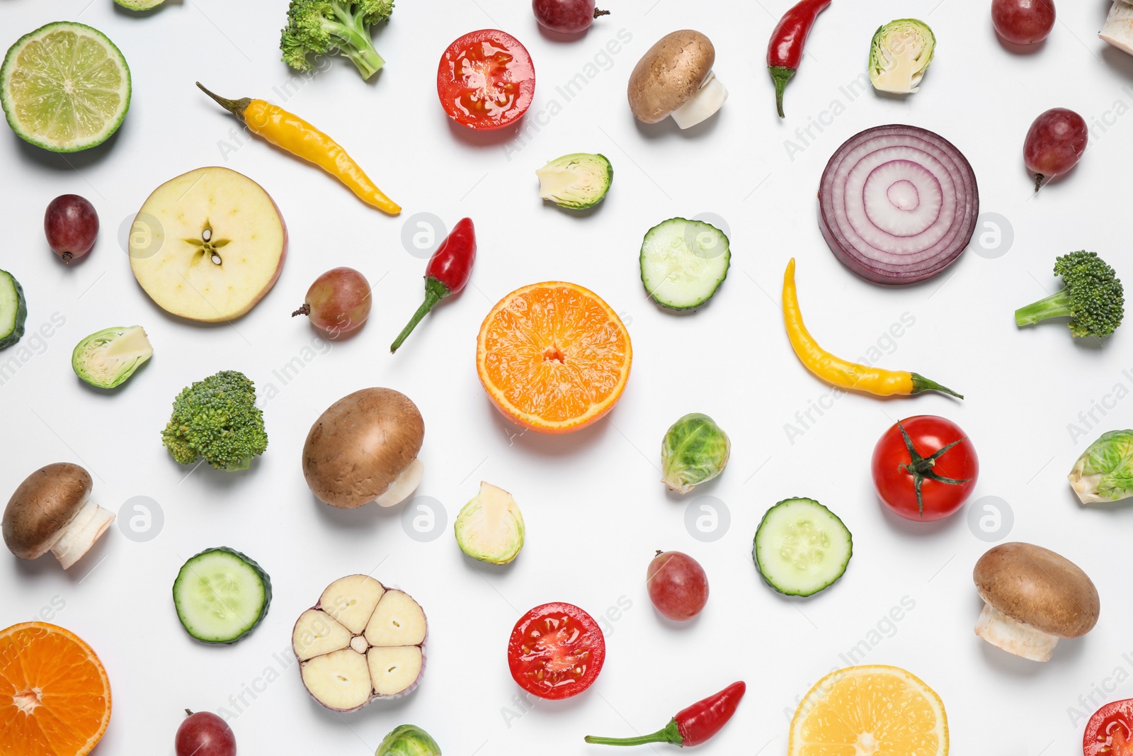 Photo of Fresh organic fruits and vegetables on white background, flat lay