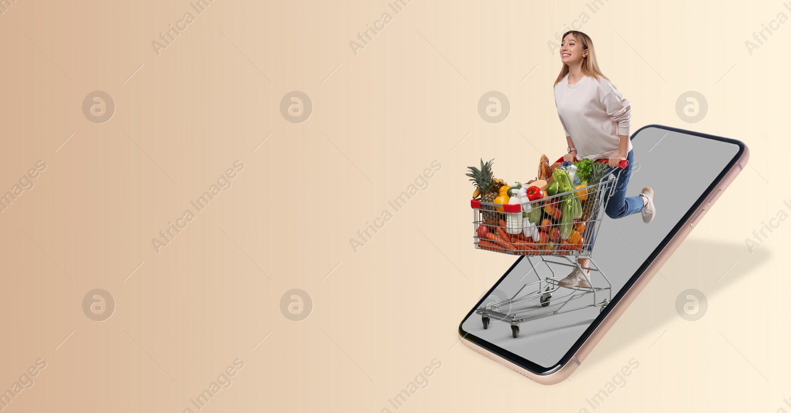 Image of Online purchases. Woman with shopping cart full of different products running out from smartphone on beige background. Banner design with space for text