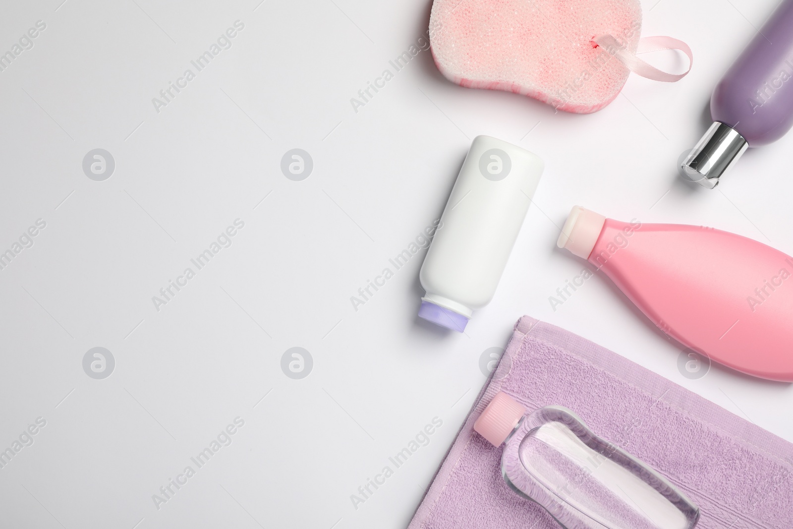 Photo of Flat lay composition with baby cosmetic products on white background, space for text