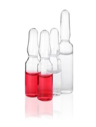 Different ampoules with pharmaceutical products on white background