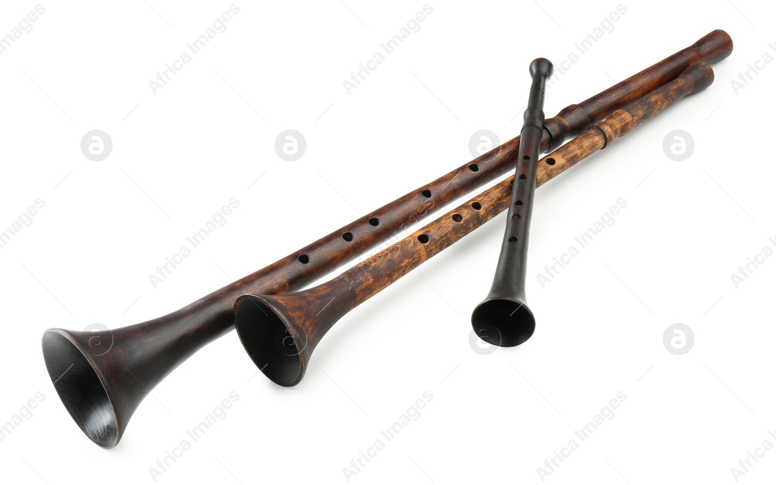 Photo of Vintage bryolkas on white background. Woodwind musical instruments