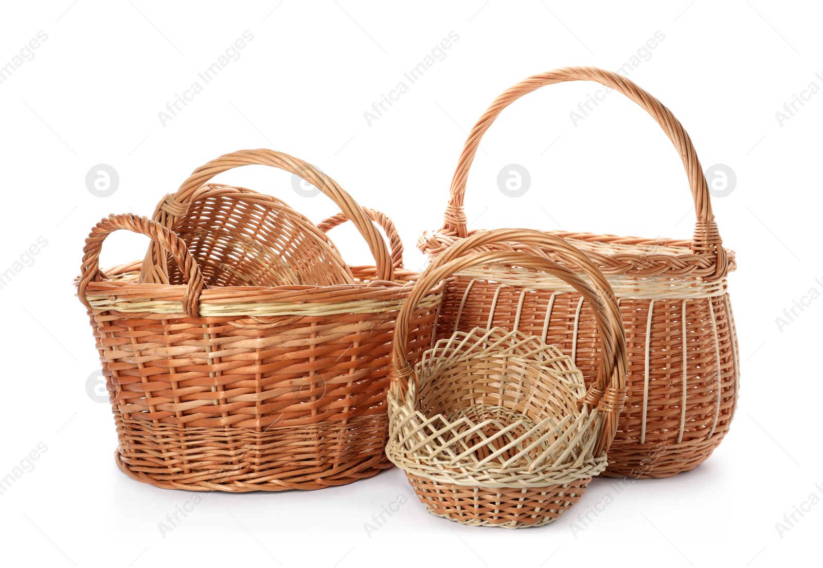 Photo of Many decorative wicker baskets on white background