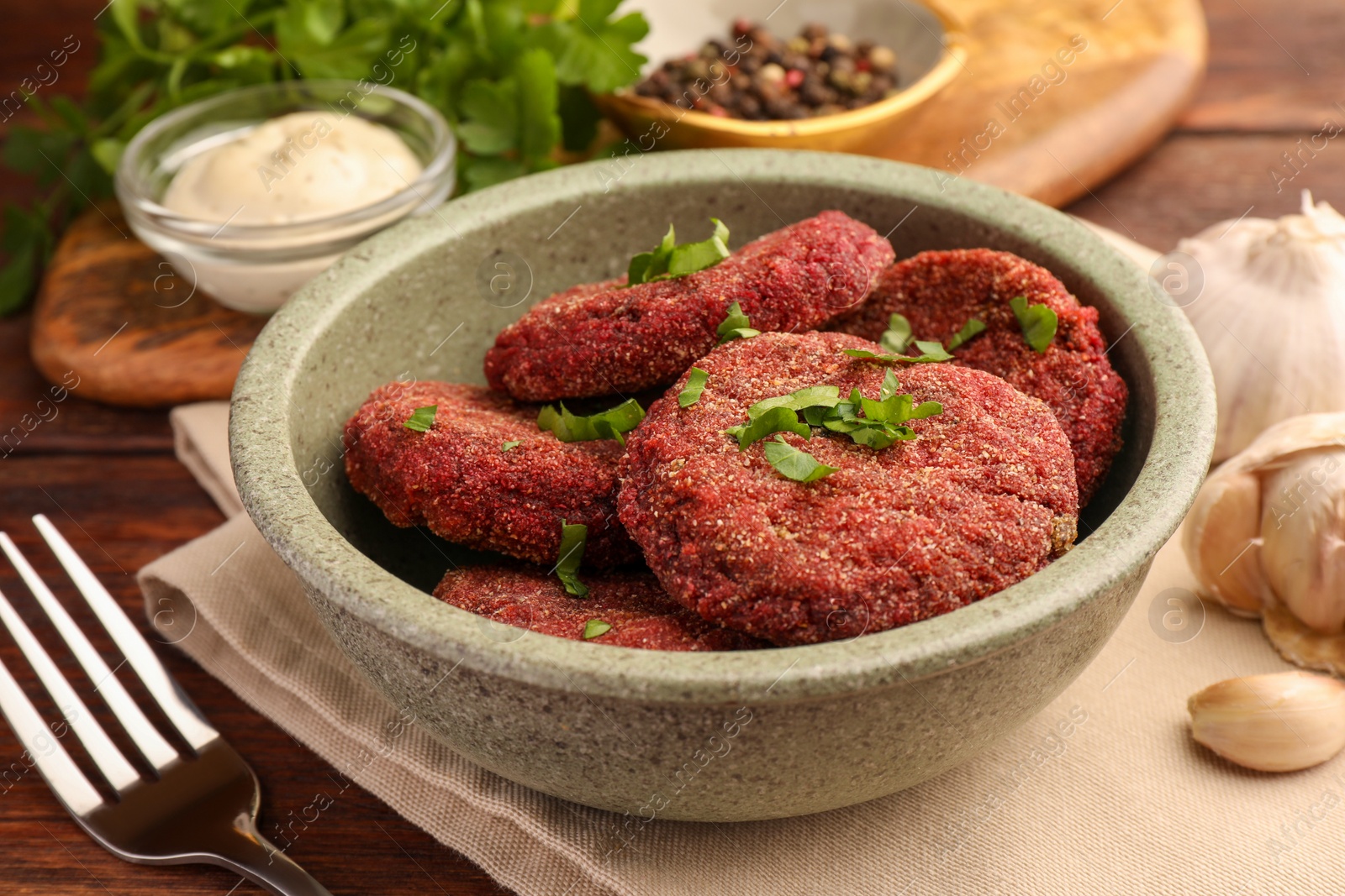 Photo of Tasty vegan cutlets served on wooden table, closeup