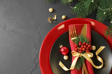 Beautiful Christmas table setting on black background, top view. Space for text