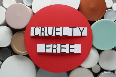 Photo of Cards with text Cruelty Free on personal care products, top view. Stop animal tests