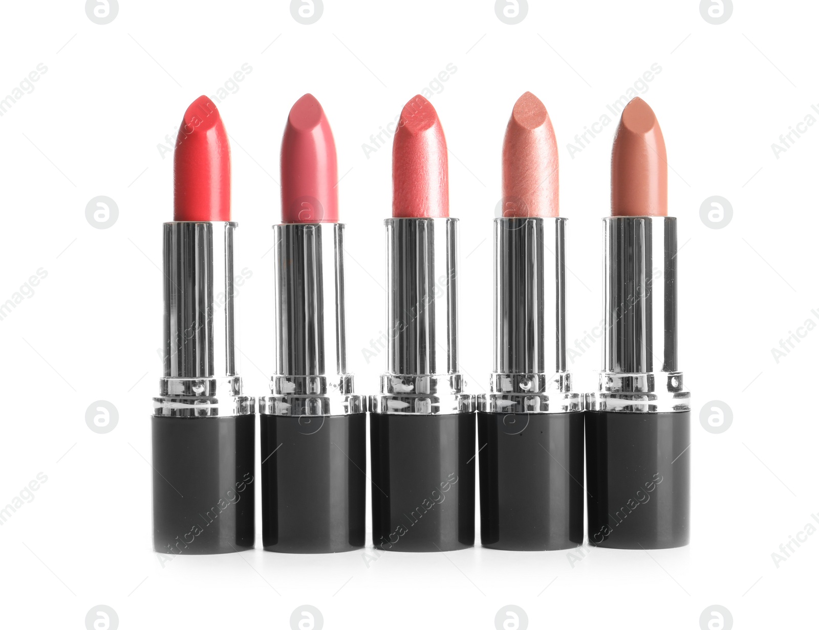 Photo of Different lipsticks on white background. Cosmetic product