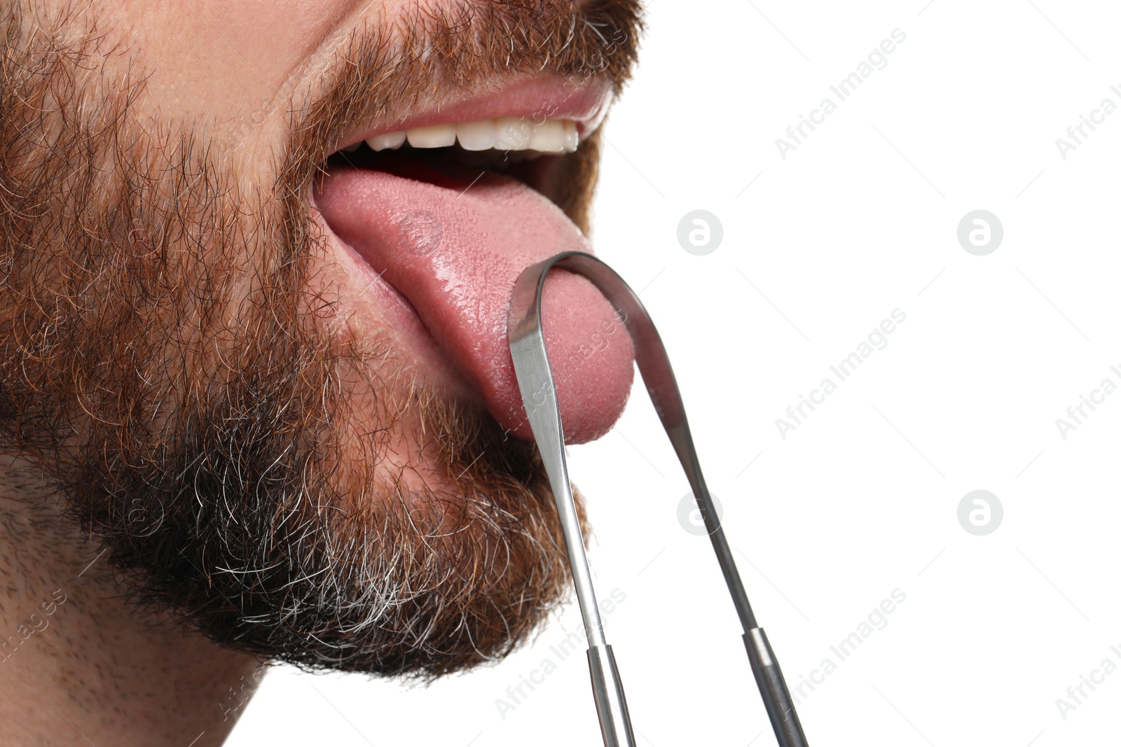 Photo of Man brushing his tongue with cleaner on white background, closeup