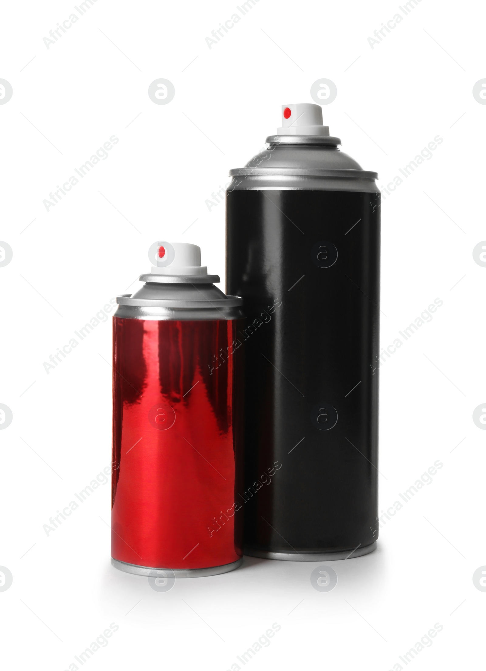 Photo of Different cans of spray paints on white background