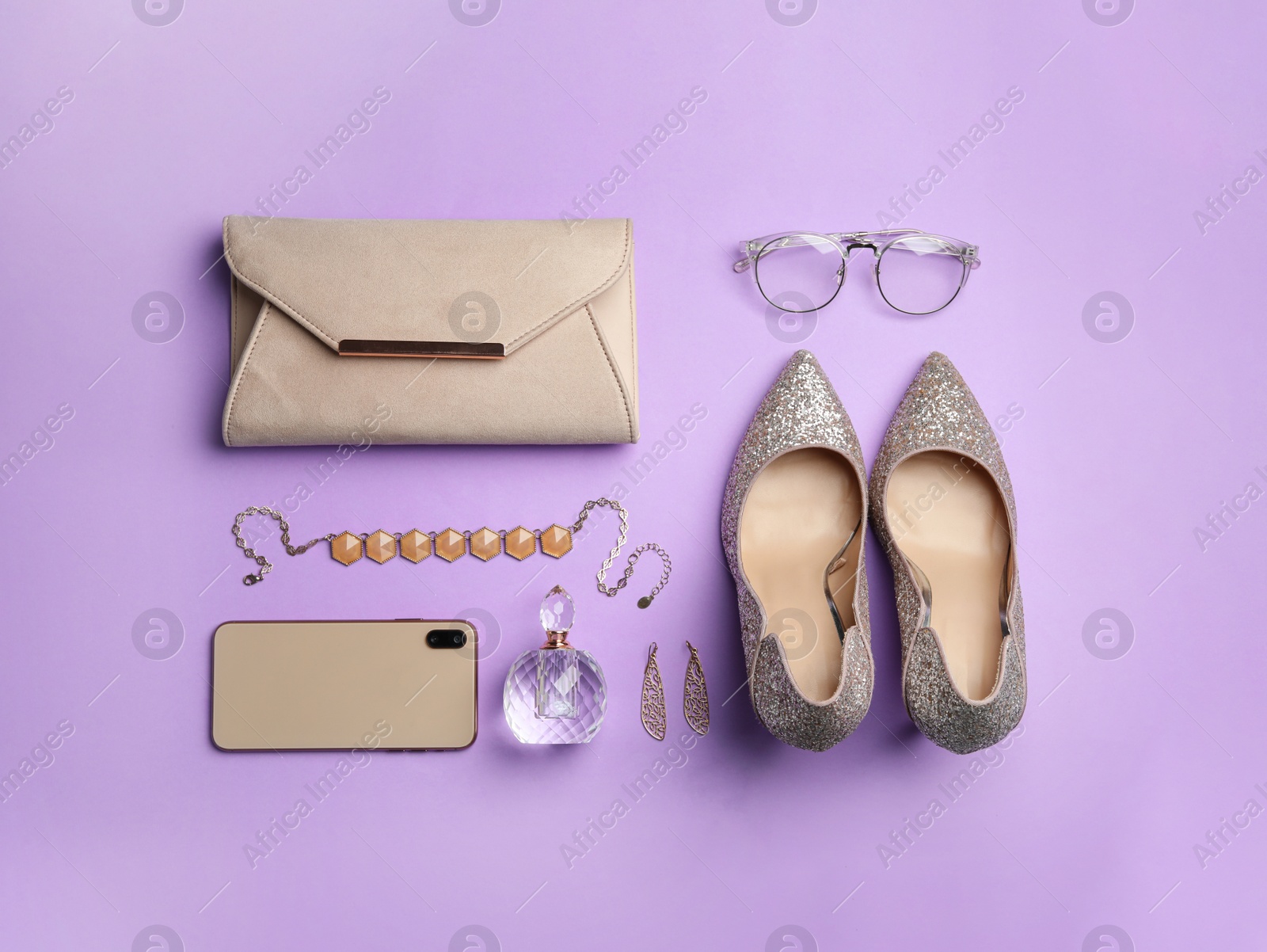 Photo of Flat lay composition with stylish woman's bag and accessories on violet background