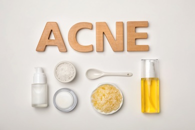 Photo of Word "Acne" and fresh ingredients for homemade problem skin remedy on white background
