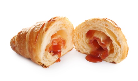 Photo of Fresh croissant with jam stuffing on white background. French pastry