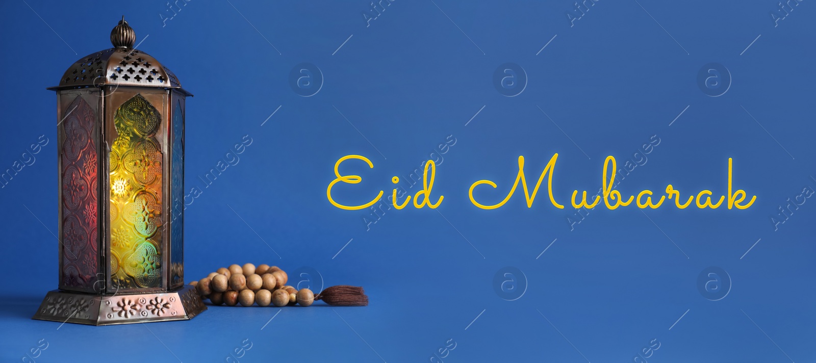Image of Eid Mubarak banner. Arabic lantern and misbaha on blue background