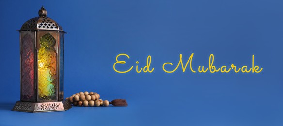 Image of Eid Mubarak banner. Arabic lantern and misbaha on blue background