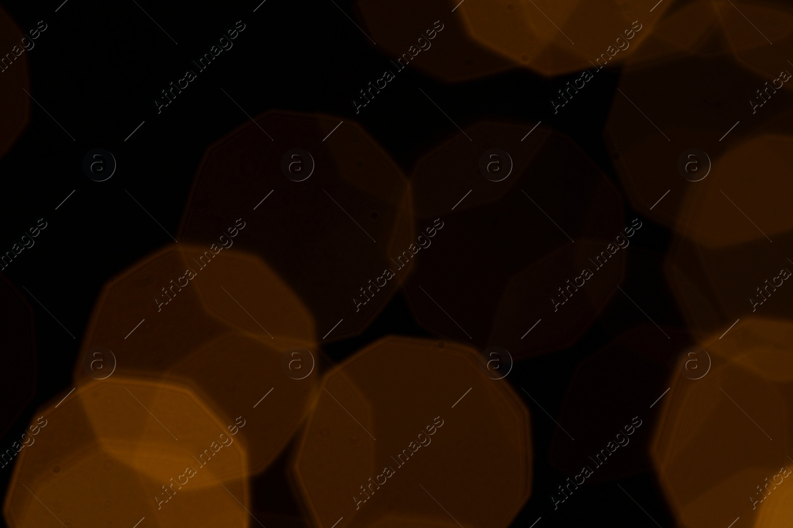 Photo of Blurred view of beautiful lights on black background. Bokeh effect