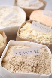 Photo of Sacks with different types of flours, closeup