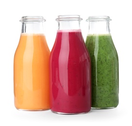 Bottles with delicious detox smoothies on white background