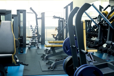 Photo of Interior of modern gym with new equipment